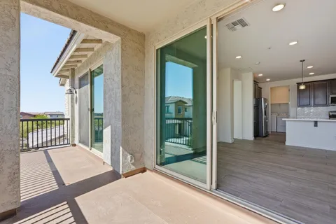 a swimming pool with outdoor seating and yard