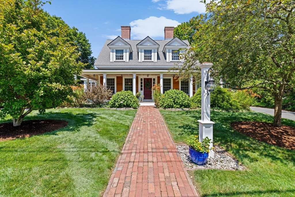 71 High Street Canton, MA 02021 - Photo 1 of 42 a front view of a house with a yard