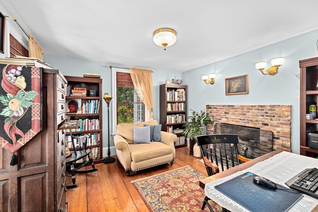 71 High Street Canton, MA 02021 - Photo 16 of 42 a living room with furniture and a book shelf