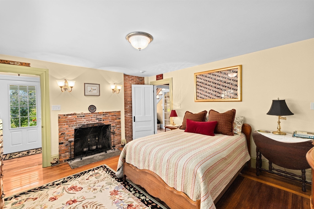 71 High Street Canton, MA 02021 - Photo 21 of 42 a bedroom with a bed and a fireplace