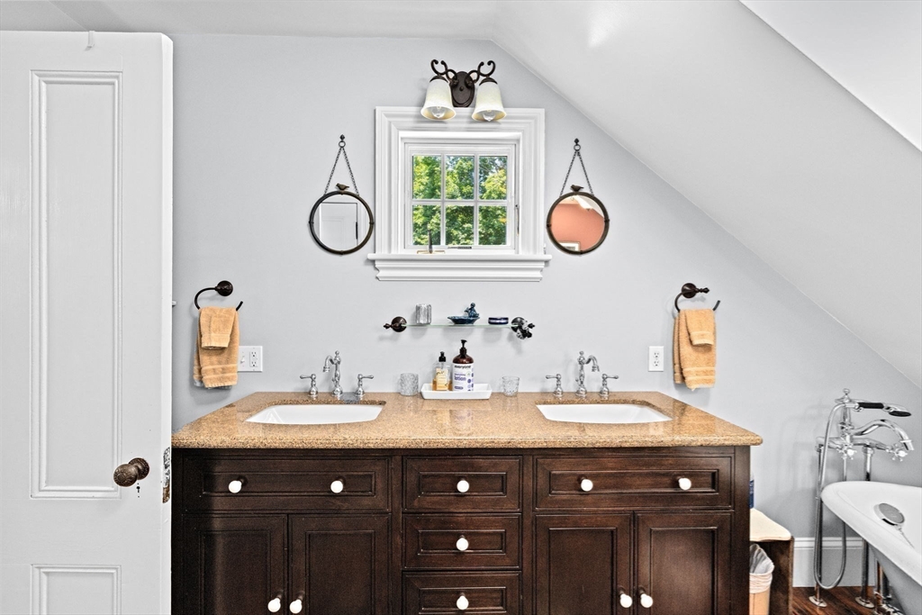 71 High Street Canton, MA 02021 - Photo 24 of 42 a bathroom with a sink vanity and a mirror