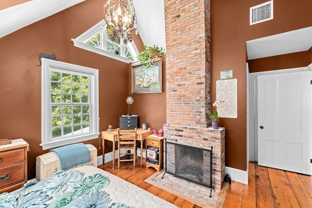 71 High Street Canton, MA 02021 - Photo 28 of 42 a living room with furniture a fireplace and a large window
