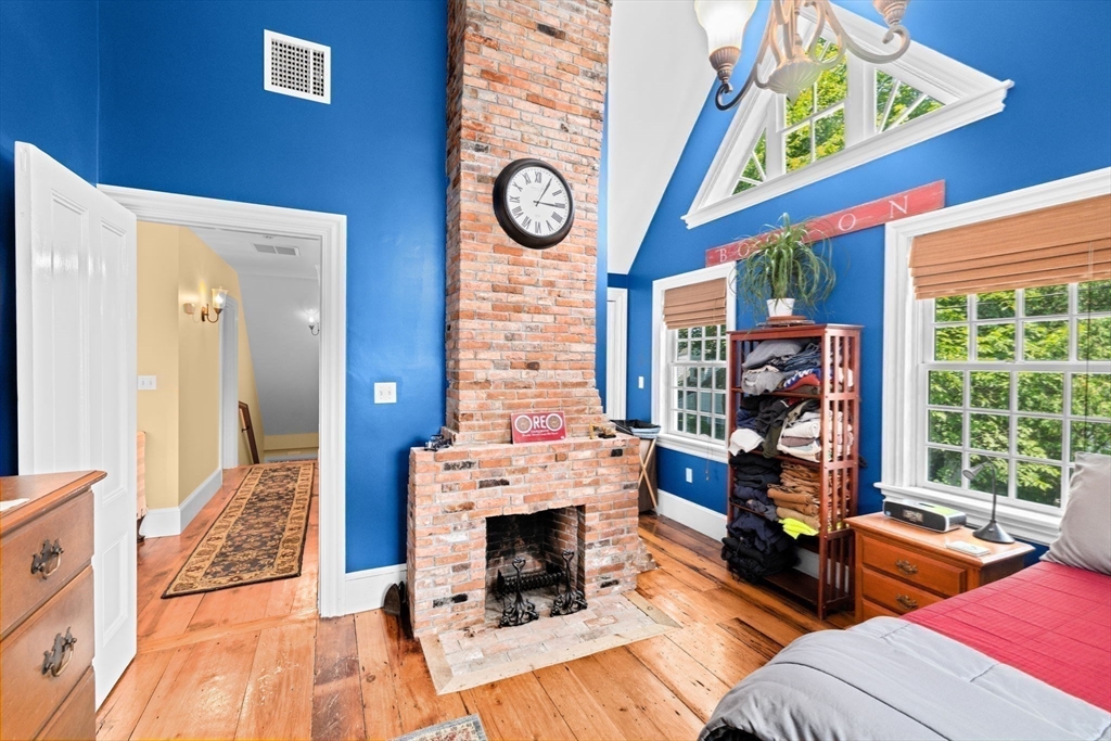 71 High Street Canton, MA 02021 - Photo 30 of 42 a living room with furniture a fireplace and a large window
