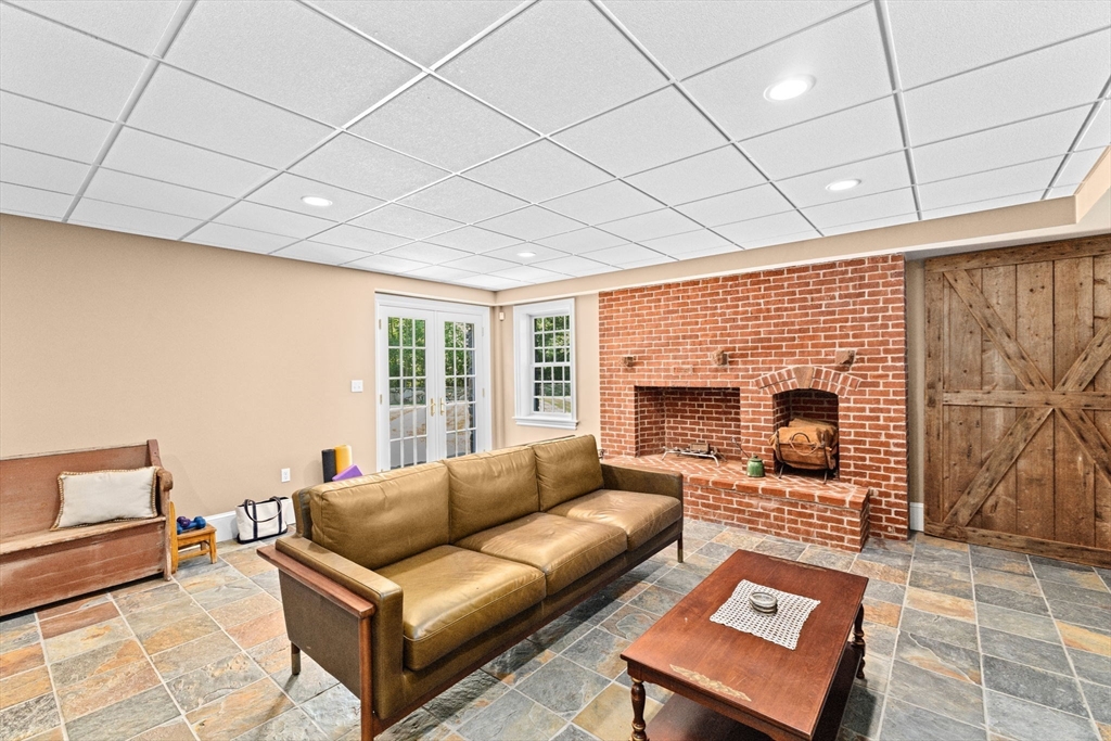71 High Street Canton, MA 02021 - Photo 31 of 42 a living room with furniture and a fireplace