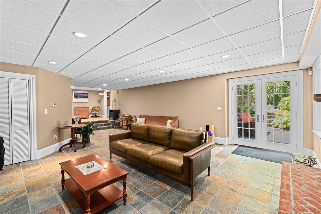 71 High Street Canton, MA 02021 - Photo 32 of 42 a living room with furniture and a wooden floor