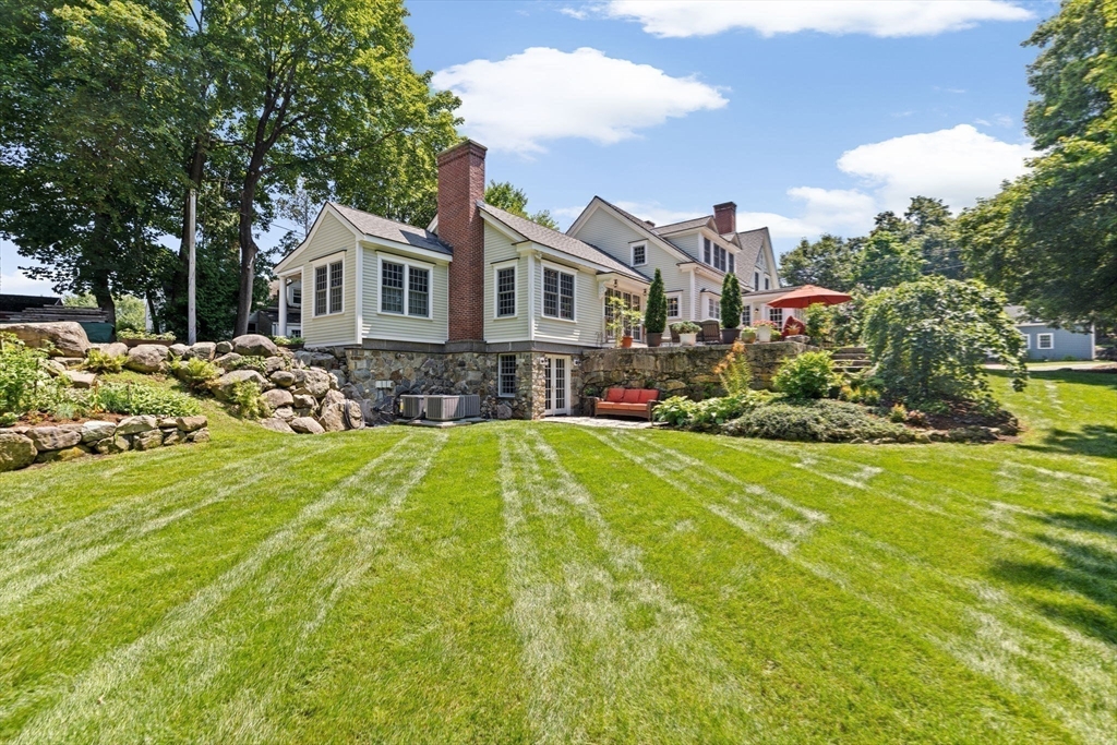 71 High Street Canton, MA 02021 - Photo 34 of 42 a view of a house with a yard patio and swimming pool
