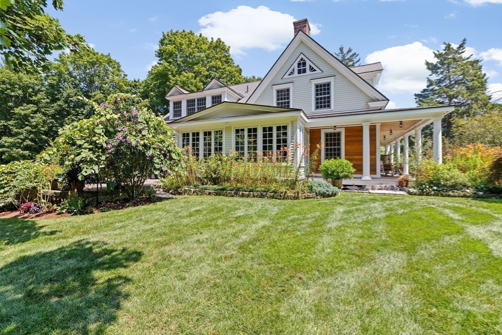 71 High Street Canton, MA 02021 - Photo 37 of 42 a front view of a house with a yard and trees