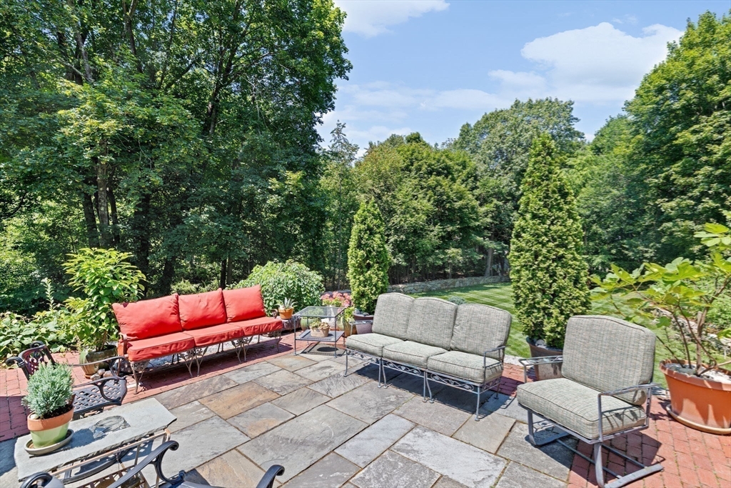 71 High Street Canton, MA 02021 - Photo 39 of 42 a backyard of a house with outdoor seating