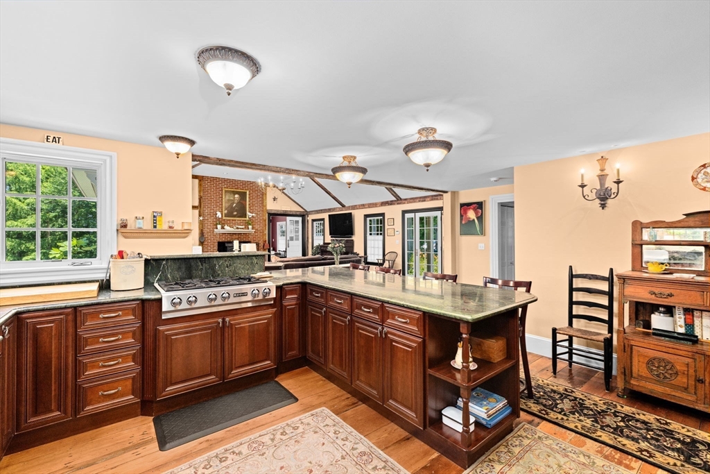 71 High Street Canton, MA 02021 - Photo 7 of 42 a kitchen with a stove a sink and a refrigerator