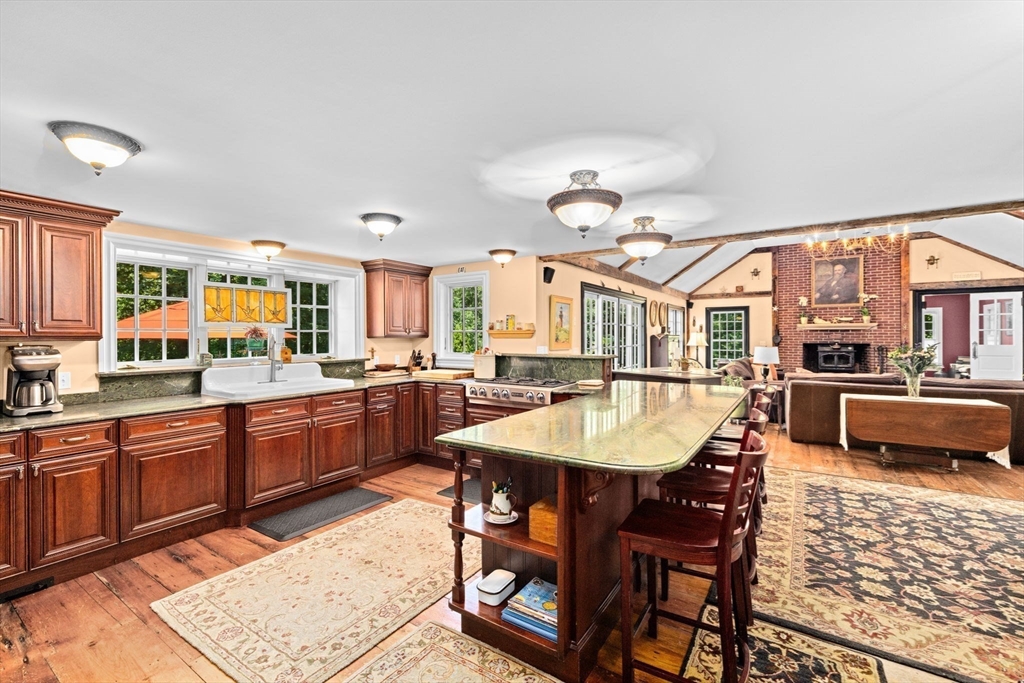 71 High Street Canton, MA 02021 - Photo 9 of 42 a large kitchen with a table and chairs