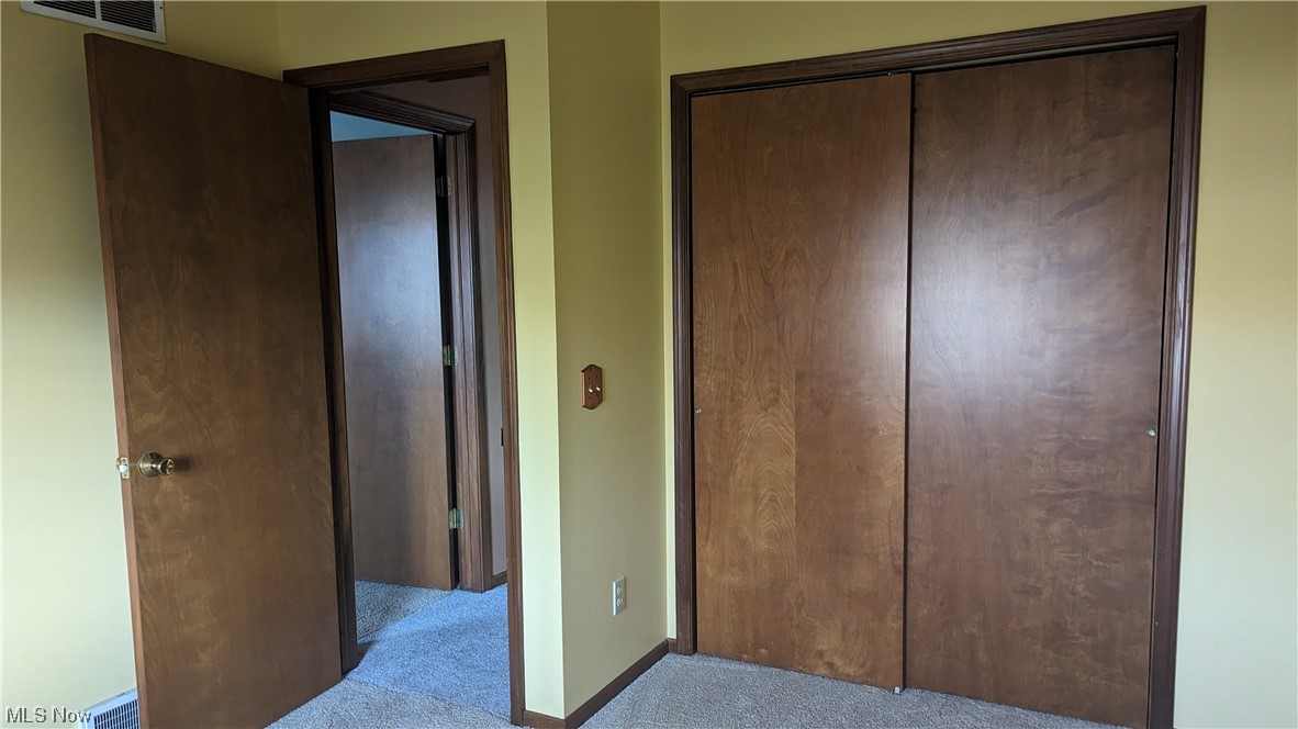 1531 Bravado Road Southwest Canton, OH 44706 - Photo 22 of 31 Unfurnished bedroom featuring a closet and light colored carpet