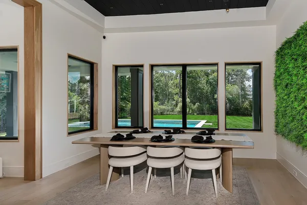 a view of a dining room with furniture and window