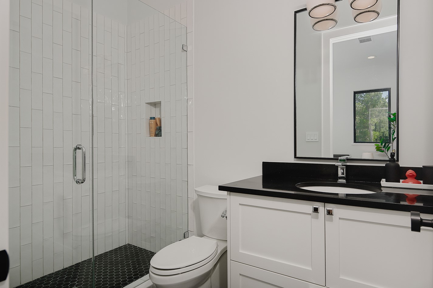 425 Copa Palm Loop Montgomery, TX 77316 - Photo 32 of 39 a bathroom with a granite countertop sink a toilet and shower