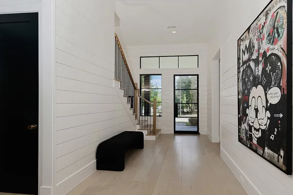 a view of a entryway door with wooden floor