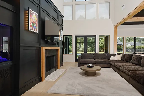 a living room with furniture and a fireplace