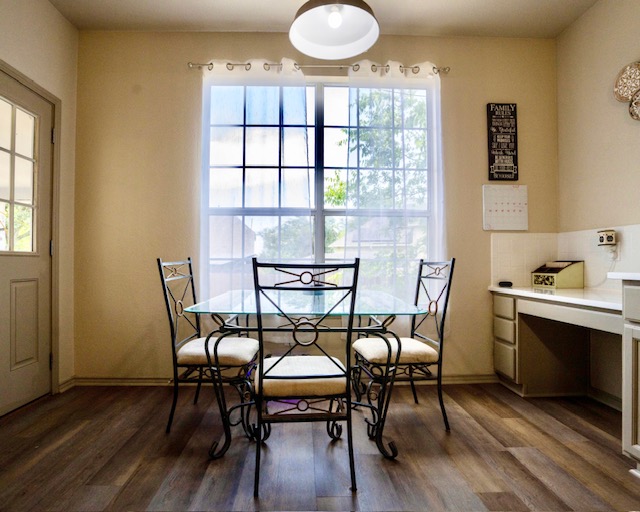 1406 Apache Cove Pflugerville, TX 78660 - Photo 13 of 40 a dining room with furniture and wooden floor