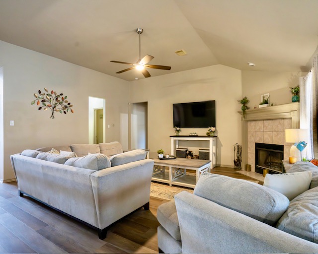 1406 Apache Cove Pflugerville, TX 78660 - Photo 14 of 40 a living room with furniture flat screen tv and a fireplace