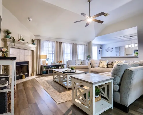 a view of a livingroom with furniture and a fireplace