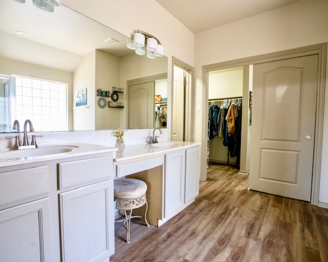 1406 Apache Cove Pflugerville, TX 78660 - Photo 21 of 40 a kitchen with a refrigerator sink and cabinets