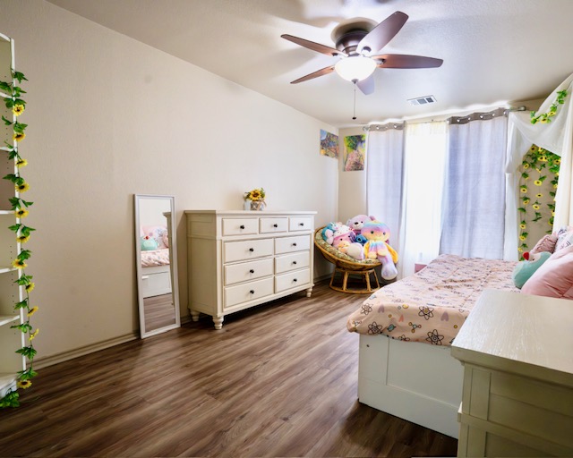 1406 Apache Cove Pflugerville, TX 78660 - Photo 23 of 40 a bedroom with furniture and window