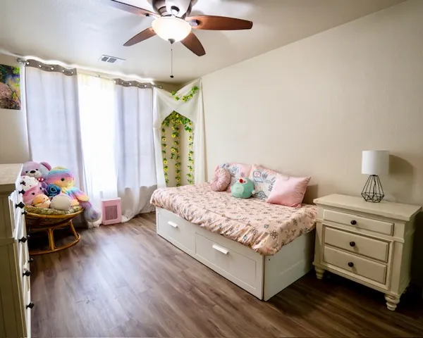 a bedroom with a bed and a window