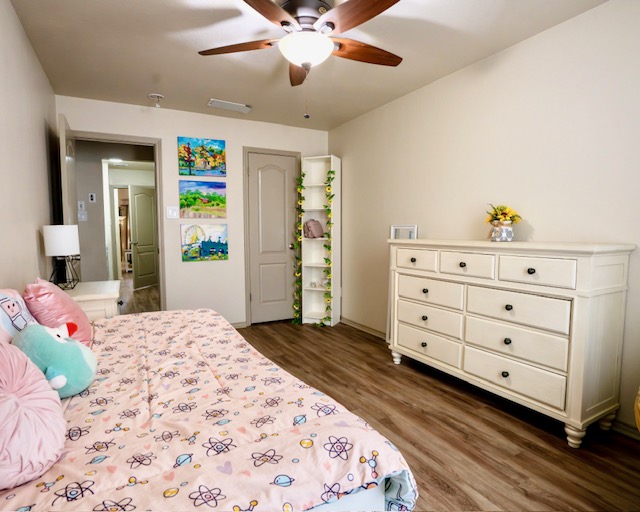 1406 Apache Cove Pflugerville, TX 78660 - Photo 25 of 40 a bedroom with a bed and a dresser
