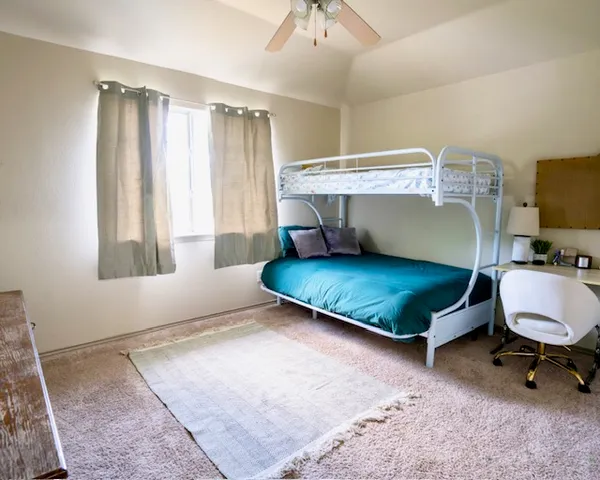 a living room with furniture rug and window