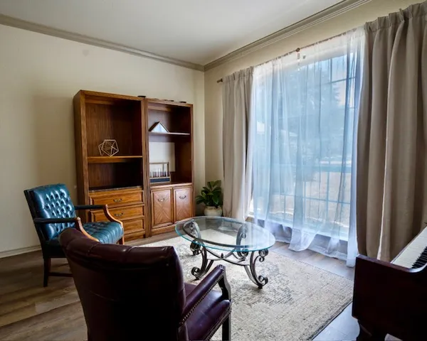 a living room with furniture and a window