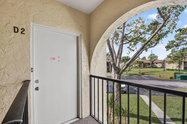 a view of a balcony with a tree