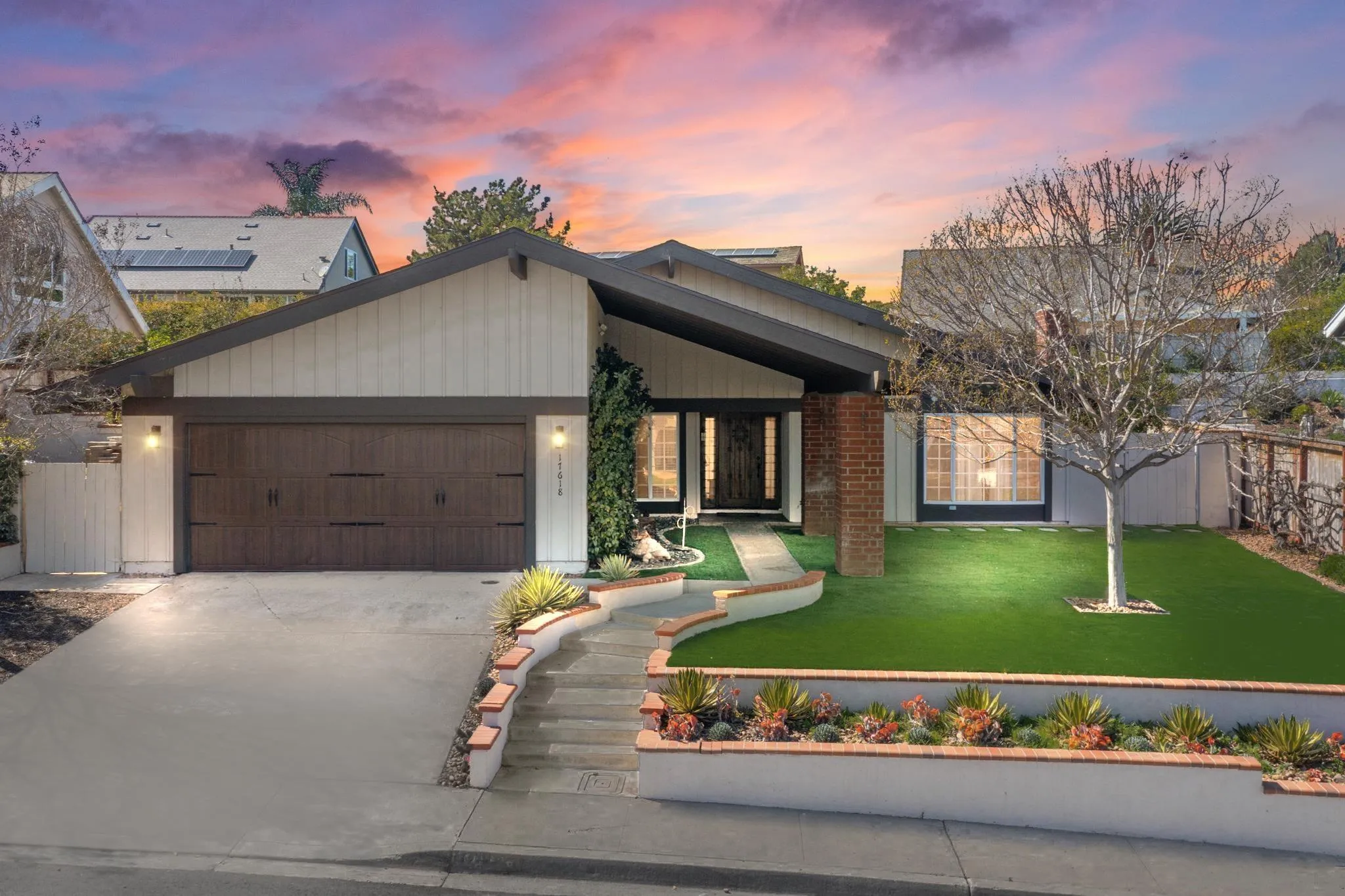 17618 Cabela Drive San Diego, CA 92127 - Photo 1 of 1 a view of a house with a yard and a garden