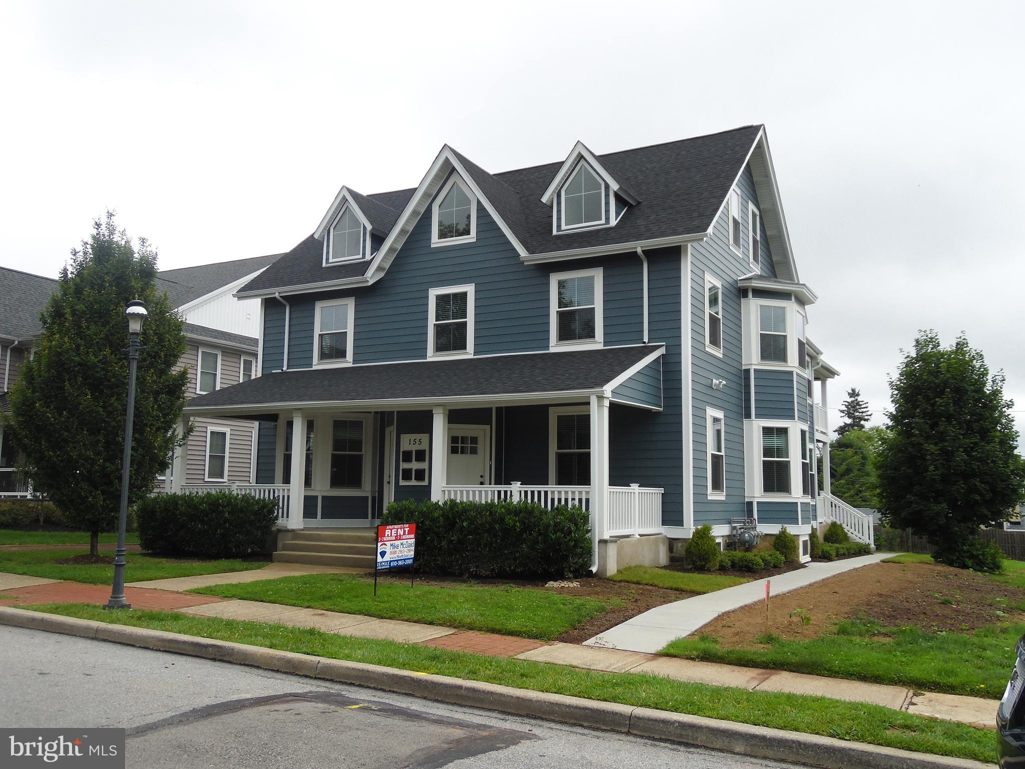 155 Channing Avenue, Unit 3 Malvern, PA 19355 - Photo 2 of 16 a front view of a house with a yard