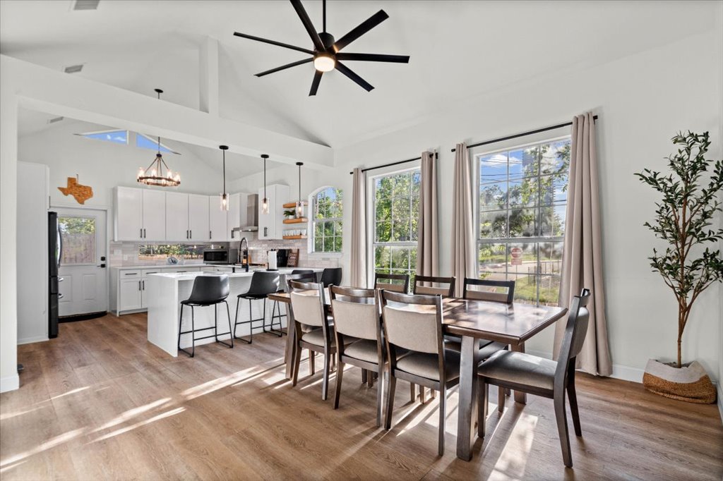 1201 Garden Street, Unit A Austin, TX 78702 - Photo 8 of 30 Bright, airy open-concept living, with high ceilings, sleek kitchen, and dining space perfect for entertaining.