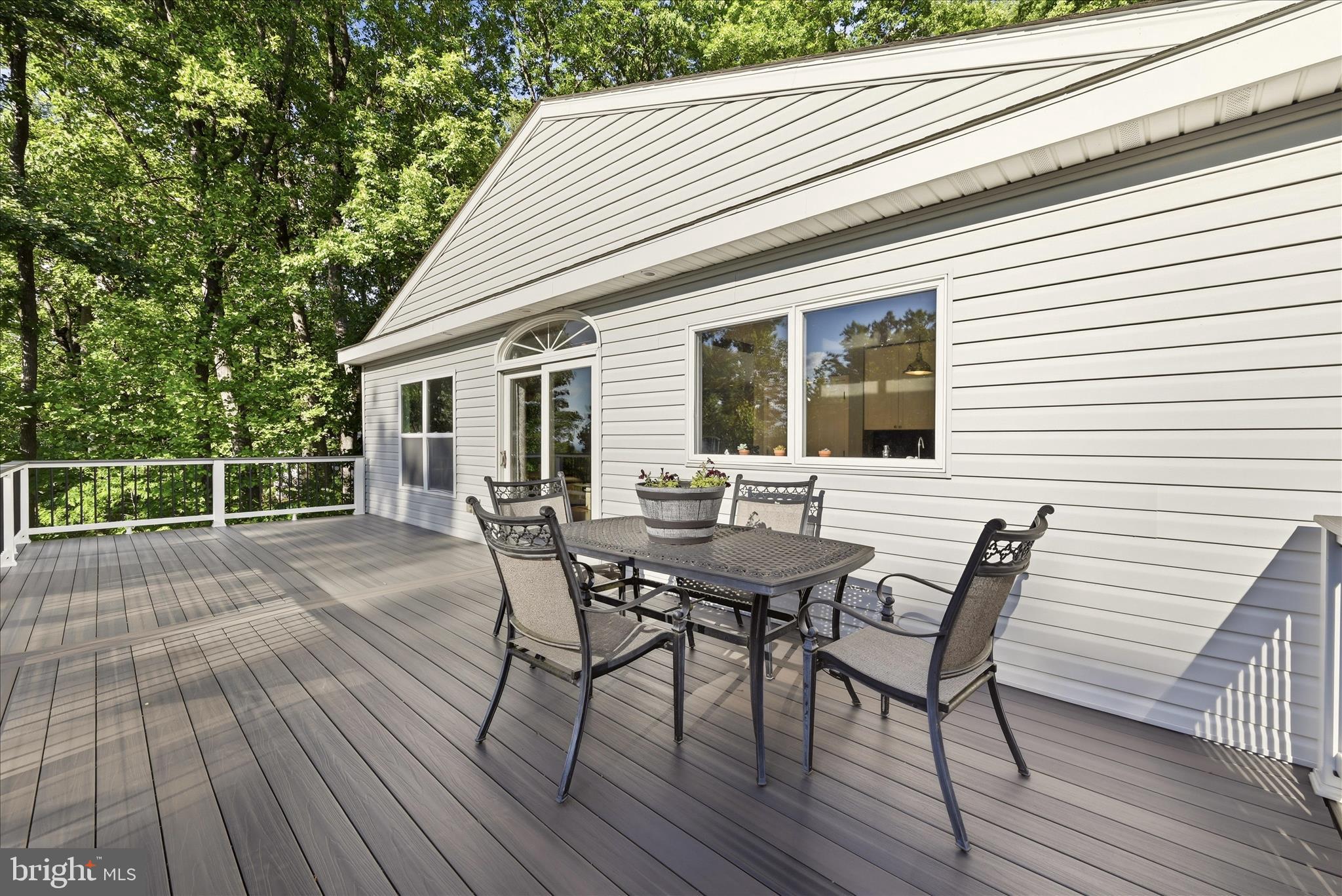 500 Delicious Road Linden, VA 22642 - Photo 36 of 80 a view of a house with wooden deck and outdoor seating