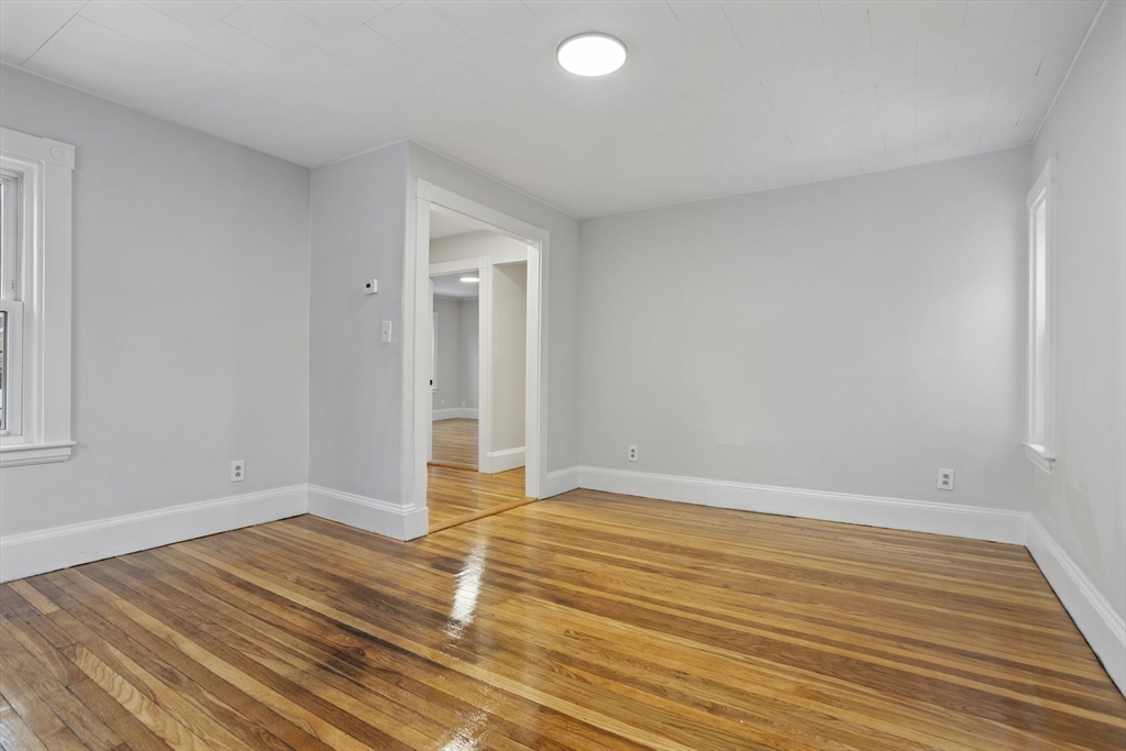 135 Cottage Street, Unit 2 Norwood, MA 02062 - Photo 12 of 30 a view of an empty room and wooden floor