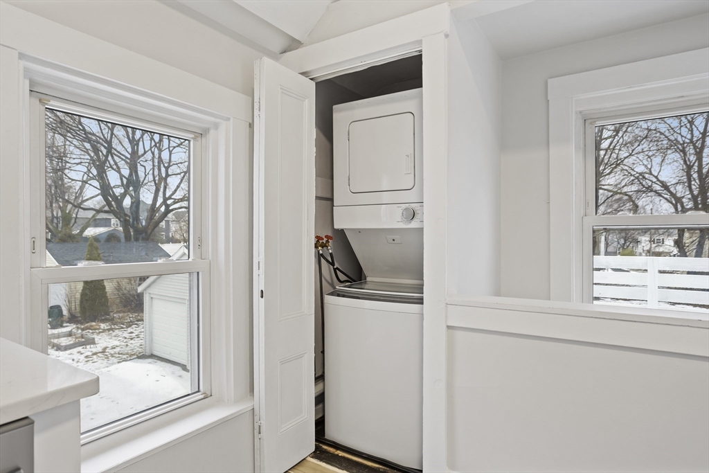135 Cottage Street, Unit 2 Norwood, MA 02062 - Photo 9 of 30 a kitchen with a refrigerator and a window