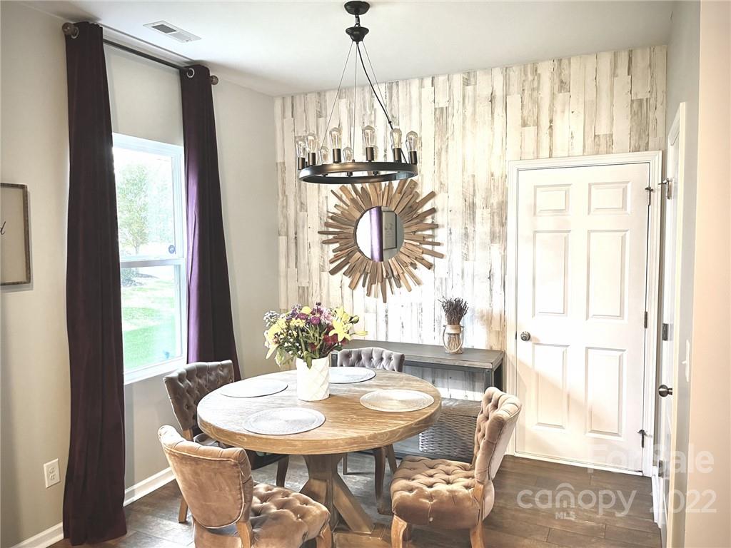 7402 Cedarfield Road Charlotte, NC 28227 - Photo 6 of 15 a dining room with furniture and window