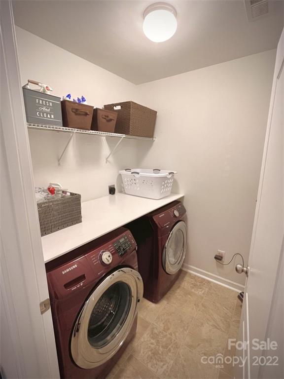 7402 Cedarfield Road Charlotte, NC 28227 - Photo 10 of 15 a utility room with dryer and washer