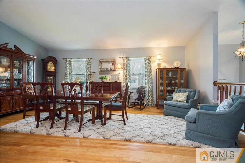 69 Wilk Road Edison, NJ 08837 - Photo 2 of 19 a living room with lots of furniture and a wooden floor