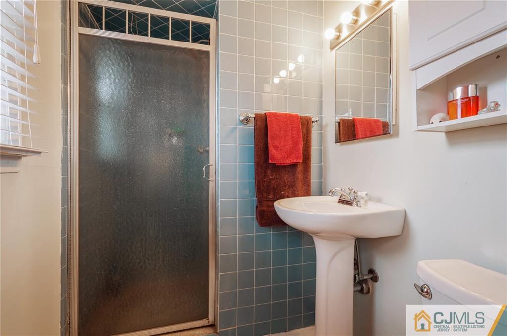 69 Wilk Road Edison, NJ 08837 - Photo 11 of 19 a bathroom with a sink toilet and shower