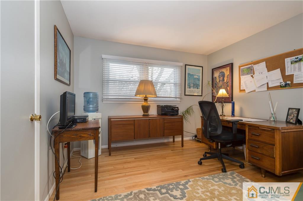 69 Wilk Road Edison, NJ 08837 - Photo 13 of 19 a view of a workspace with furniture and a window