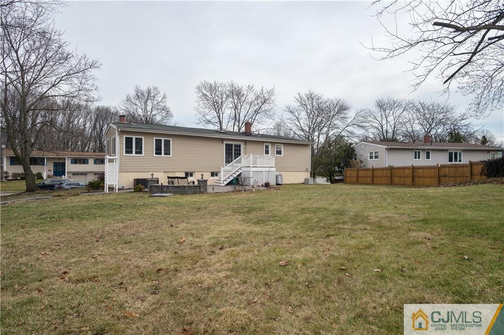 69 Wilk Road Edison, NJ 08837 - Photo 18 of 19 a front view of house with yard and trees