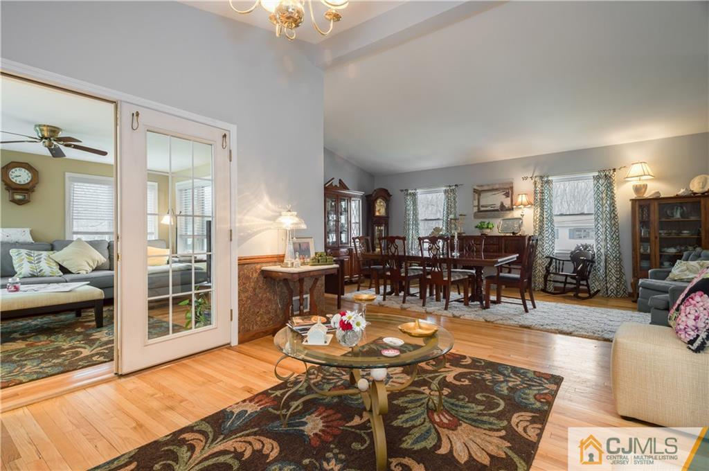 69 Wilk Road Edison, NJ 08837 - Photo 3 of 19 a living room with furniture a rug and a large window