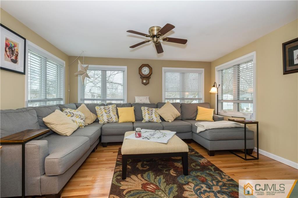 69 Wilk Road Edison, NJ 08837 - Photo 9 of 19 a living room with furniture and a large window