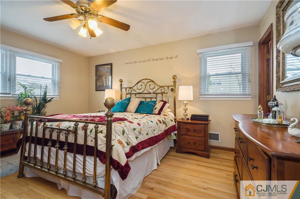 69 Wilk Road Edison, NJ 08837 - Photo 10 of 19 a bedroom with a bed and a table