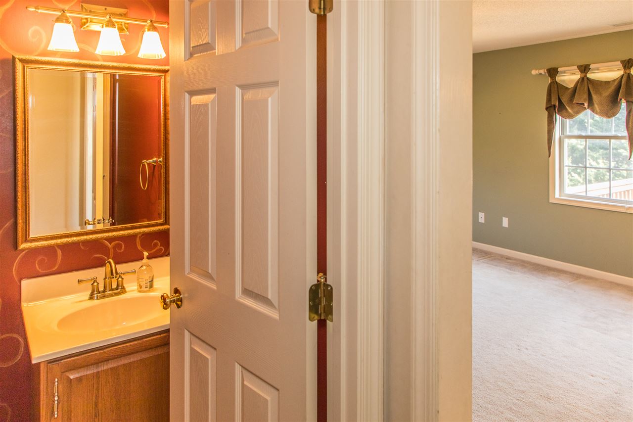 58 Long Bow Road Waynesboro, VA 22980 - Photo 12 of 42 a bathroom with a sink a toilet and a mirror