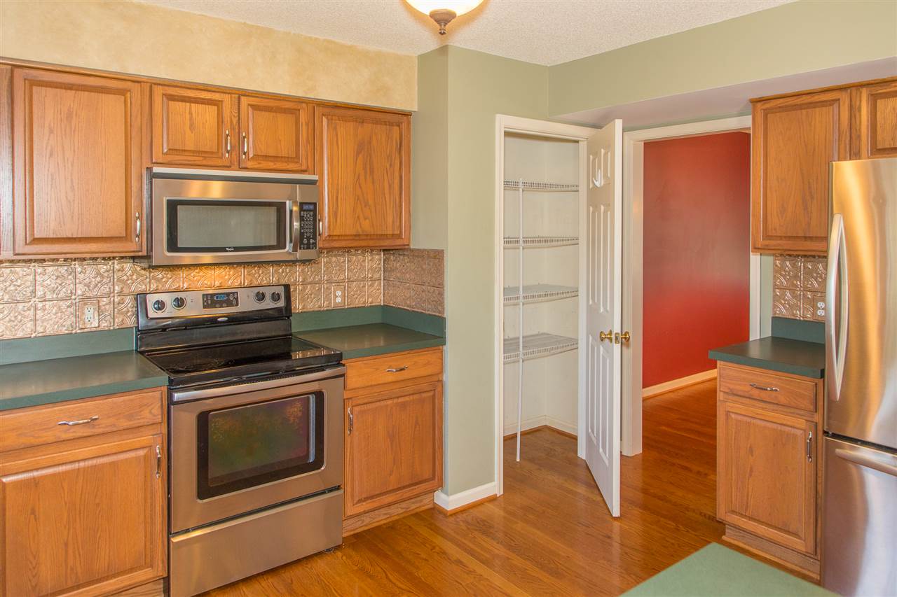 58 Long Bow Road Waynesboro, VA 22980 - Photo 24 of 42 a kitchen with granite countertop wooden cabinets and stainless steel appliances