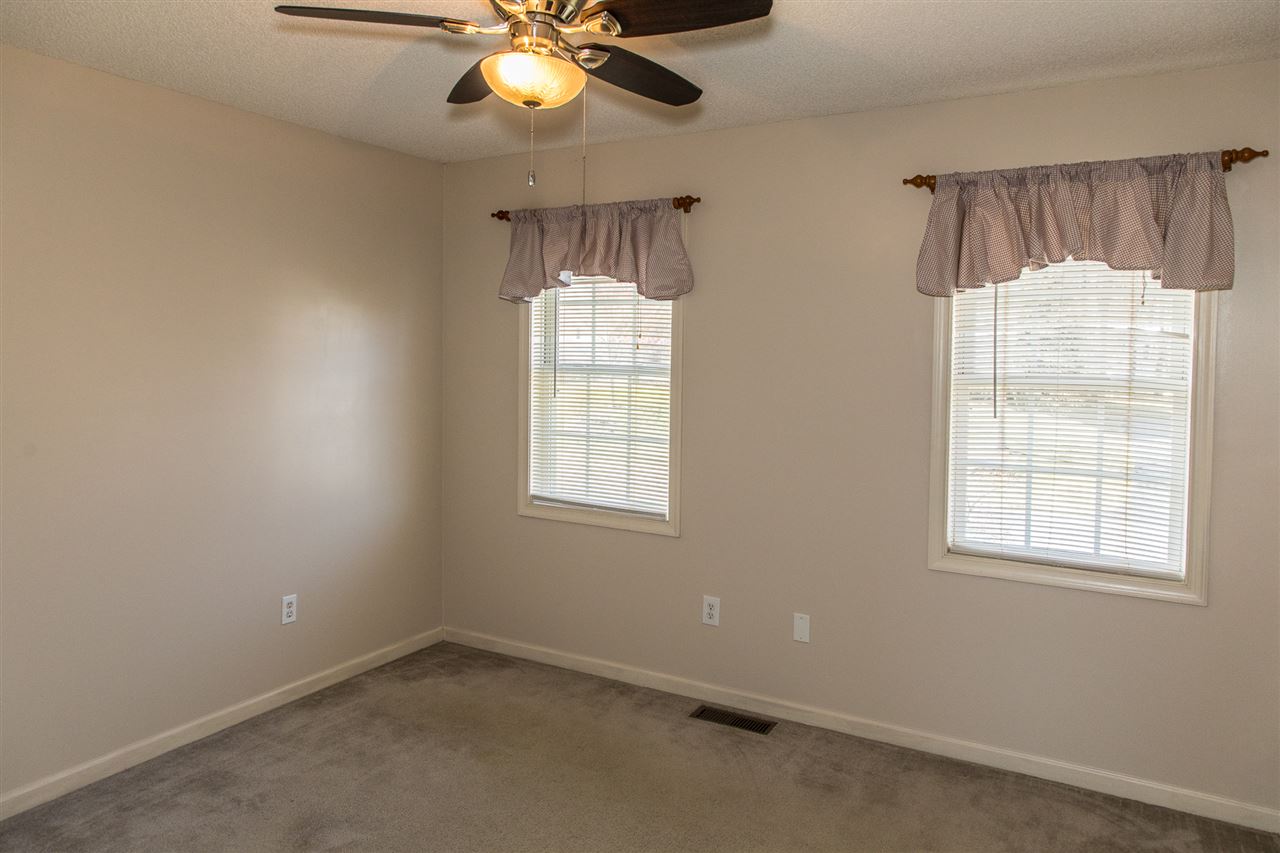 58 Long Bow Road Waynesboro, VA 22980 - Photo 27 of 42 an empty room with windows and fan