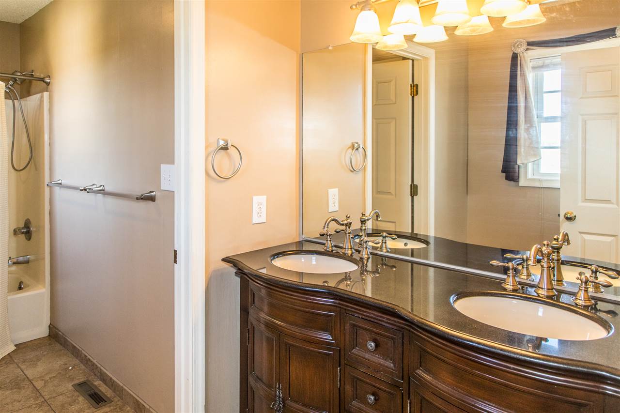 58 Long Bow Road Waynesboro, VA 22980 - Photo 35 of 42 a bathroom with a double vanity sink and a mirror
