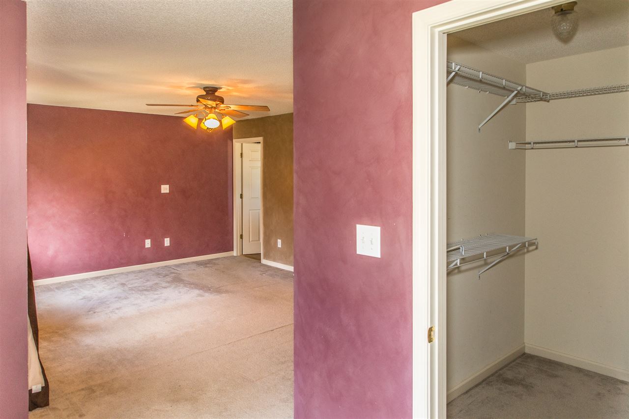 58 Long Bow Road Waynesboro, VA 22980 - Photo 40 of 42 an empty room with a hallway and chandelier