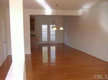 206 Pilot Court Knightdale, NC 27545 - Photo 2 of 5 a view of empty room with wooden floor and fan